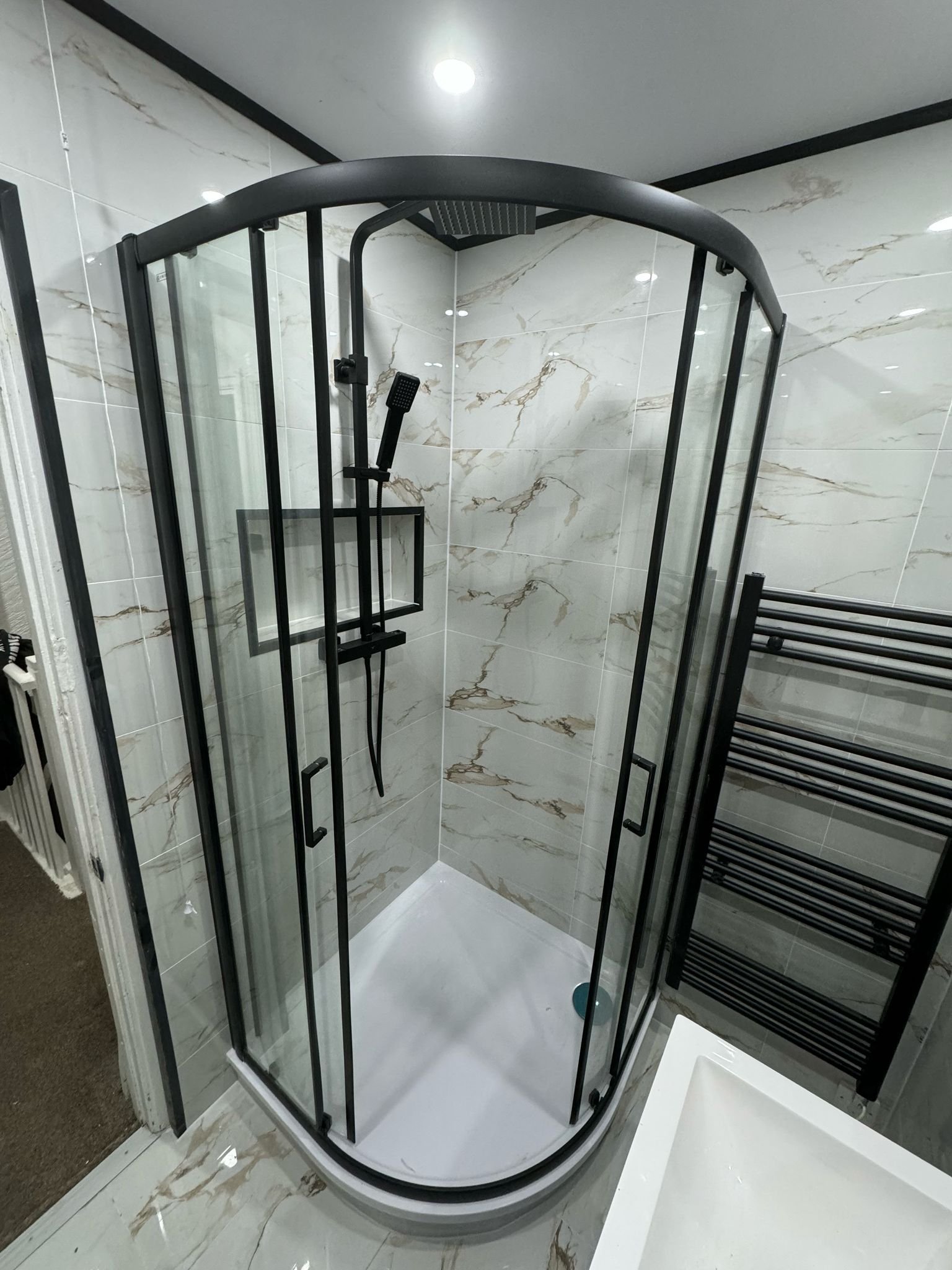Contemporary bathroom refurbishment with refined material palette
